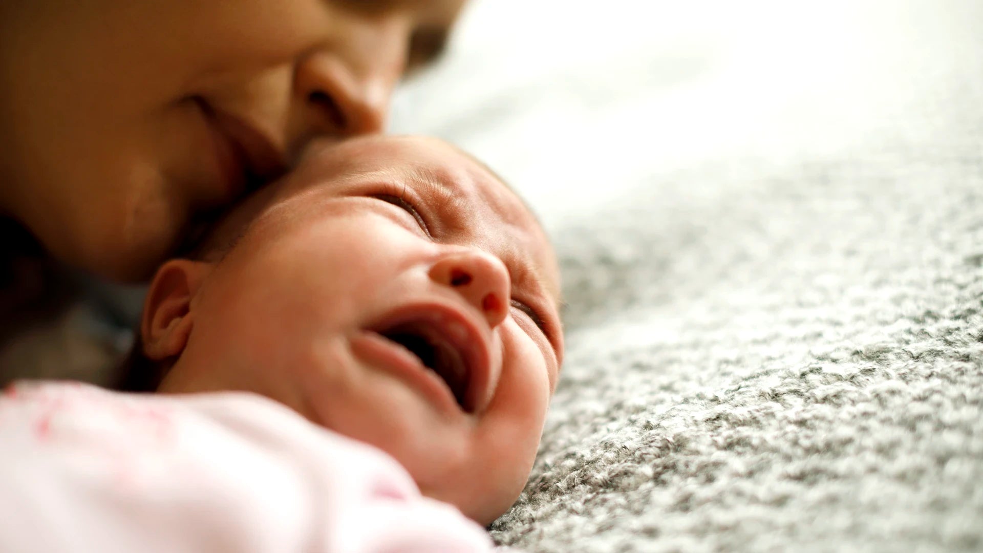 Mother comforting a crying baby