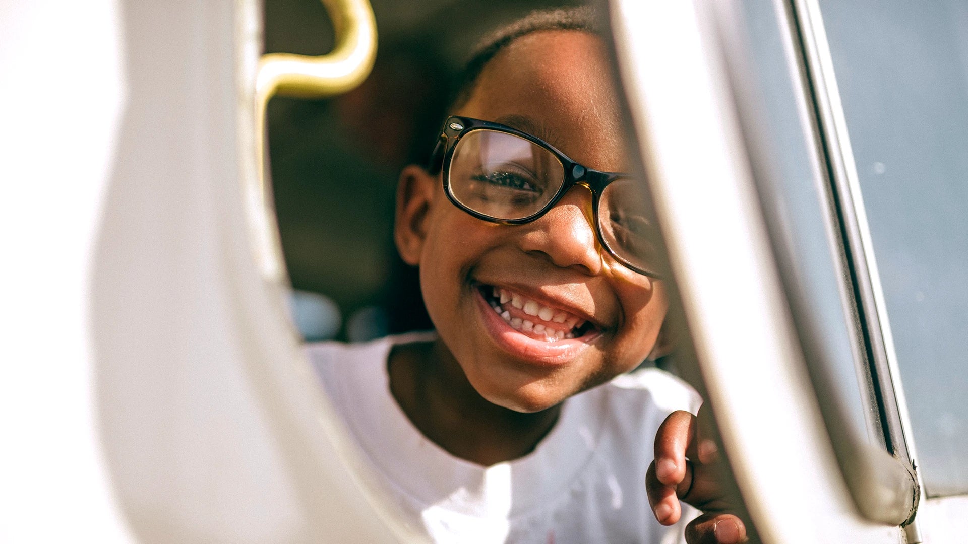 Smiling boy with glasses